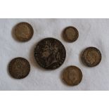 A George III crown dated 1822, together with a George II shilling 1758 and other coins,