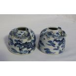 A pair of Chinese blue and white brush pots decorated with a dragon chasing a pearl,