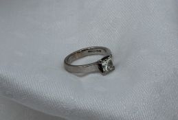 A solitaire diamond ring, the princess cut stone measuring approximately 5.25mm x 5.