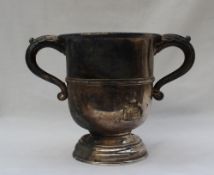 A 20th century silver twin handled trophy cup with a ring turned body on a spreading foot, Chester,