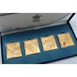 A set of four silver gilt replica stamps, produced for the 1988 Calgary winter Olympics,