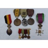 A set of three Belgian medals including a volunteer's medal;,
