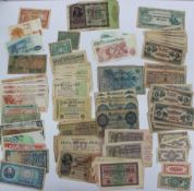 A collection of bank notes including German Reichsbanknotes, Japanese dollars, rupees,