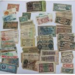 A collection of bank notes including German Reichsbanknotes, Japanese dollars, rupees,