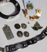 Assorted costume jewellery including a silver ingot, coin buttons, cufflinks, bracelets,