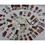 A collection of World War II medals, including Defence medals, British War medals, 1939-1945 stars,