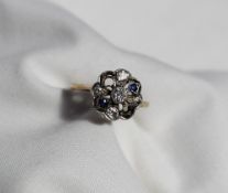 A diamond and sapphire cluster ring,