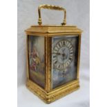 A 19th century gilt brass and repeating carriage clock, the case with leaves and scrolls,