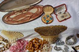 Assorted costume jewellery including enamelled shirt studs, bead necklaces, lady's wristwatches,