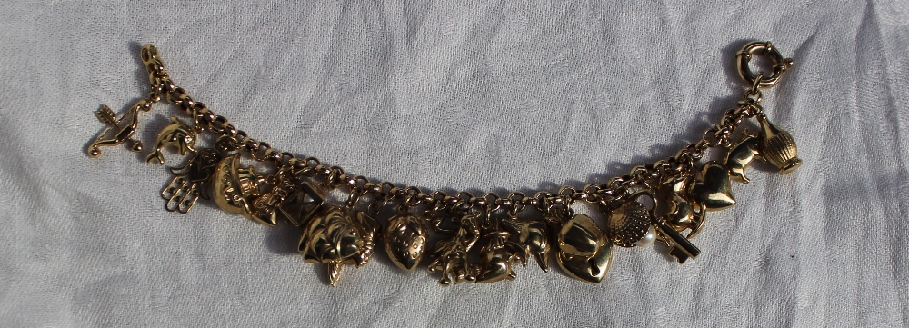A 9ct yellow gold charm bracelet, set with a dolphin, fish, giraffe, strawberry etc, marked 375, - Image 3 of 3