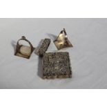 An Indian white metal card case embossed with figures, a cow, flowers, leaves and scrolls,