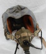 An RAF blue cloth flying helmet with leather integral headphones, mask etc,