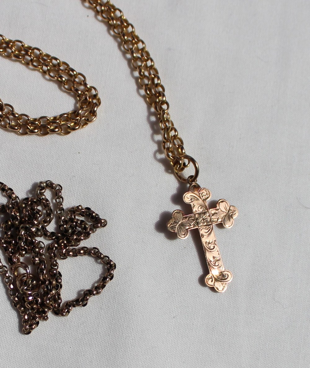 A 9ct yellow gold chain and cross, together with another 9ct gold chain,