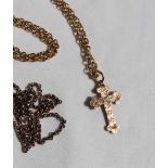 A 9ct yellow gold chain and cross, together with another 9ct gold chain,