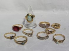 A 14ct gold opal set dress ring together with a collection of 14ct gold semi precious set dress