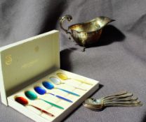 A boxed set of David Andersen enamel and gilt decorated coffee spoons, marked 925S Norway Sterling,