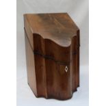 A George III mahogany knife box with a hinged serpentine front enclosing a fitted interior, 22.