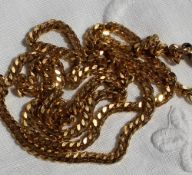 A yellow metal flattened curb link necklace, approximately 12.