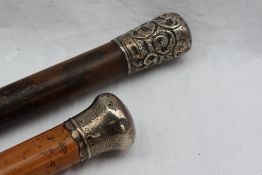A late Victorian silver topped cane decorated with scrolling leaves, London, 1893,