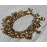 A 9ct yellow gold charm bracelet, set with a dolphin, fish, giraffe, strawberry etc, marked 375,