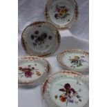 A set of five Bloor Derby porcelain plates with pierced and gilt decorated borders,