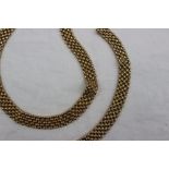 A yellow gold necklace and matching bracelet, with five rows of oval links,