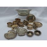 A George V silver bowls of pierced oval form, Sheffield 1913, together with silver napkin rings,