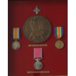 A British Empire medal issued to Ernest Phillip Cox, together with A World War I British War Medal,