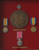 A British Empire medal issued to Ernest Phillip Cox, together with A World War I British War Medal,