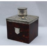 A late Victorian silver and tortoiseshell tea caddy, of rectangular form with a cylindrical cover,