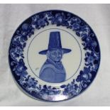 A Royal Doulton pottery plate transfer decorated with a lady in traditional welsh costume the