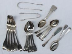 Assorted silver flatwares including spoons, tongs, butter knife, table forks, dessert spoons,