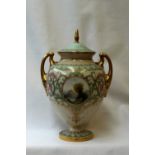 A Royal Worcester porcelain twin handled vase and cover,