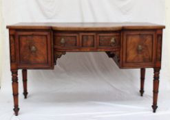 An early 19th century mahogany sideboard with a shaped front,