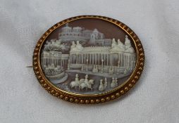 A shell cameo brooch, depicting a castle on a hill, with buildings and figures in the foreground, 5.