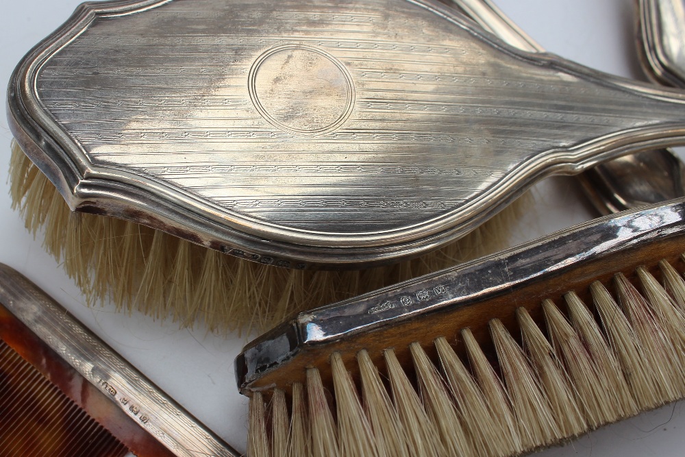 A George V silver cased dressing table set, with line decoration including a hand mirror, - Image 4 of 4