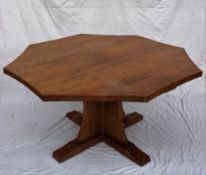 A Robert Thompson of Kilburn "Mouseman" octagonal topped dining table with an adzed top and concave