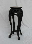 A Chinese hardwood and marble inset jardiniere stand,