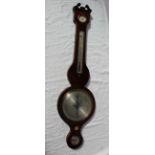 A 19th century mahogany banjo barometer, the broken swan neck pediment above a hygrometer,