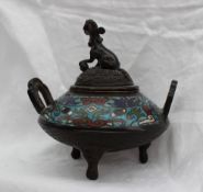 A Chinese bronze and champleve enamel twin handled Koro, with a dog of foo with paw on a ball,