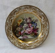 A 19th century porcelain plate with a shaped edge, the border with gilt decoration of leaves,