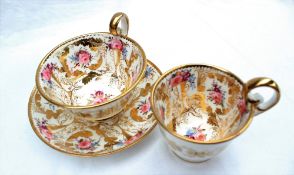 A Nantgarw porcelain trio, with a tea cup, coffee cup and saucer, each with a scalloped gilt rim,
