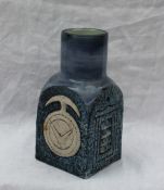 A Troika pottery vase of square form decorated with geometric patterns to a blue ground, unmarked,