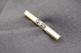 A yellow metal bar brooch,