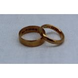 Two 22ct yellow gold wedding bands,