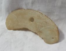 Property of a Viscount: A carved jade pendant of semi circular form pierced with three holes and