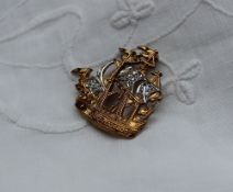 A 9ct yellow gold brooch in the form of a sailing ship, set with diamonds, approximately 5 grams,