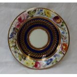 A Swansea porcelain saucer dish, painted to the border with a continuous band of garden flowers,
