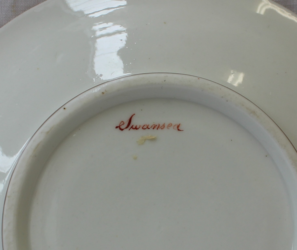 A Swansea porcelain saucer dish, painted to the border with a continuous band of garden flowers, - Image 4 of 4