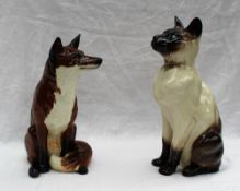 A Beswick model of a seated fireside fox No. 2348, 31.